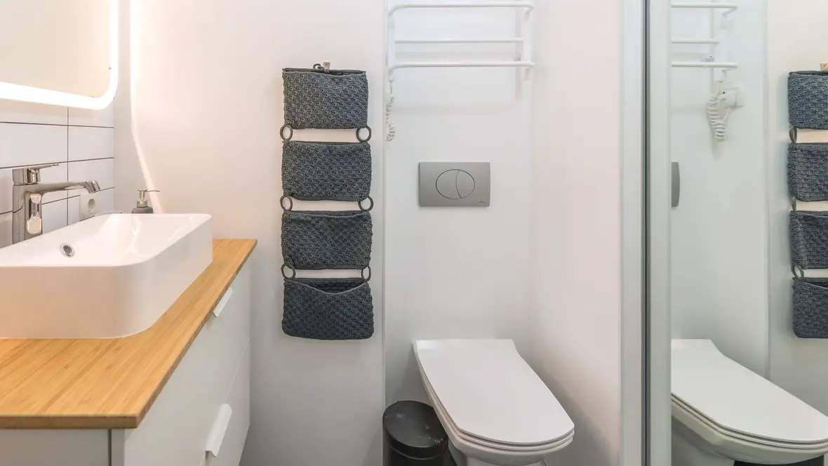 Line diagram of a two-piece toilet showing tank, bowl and floor connection